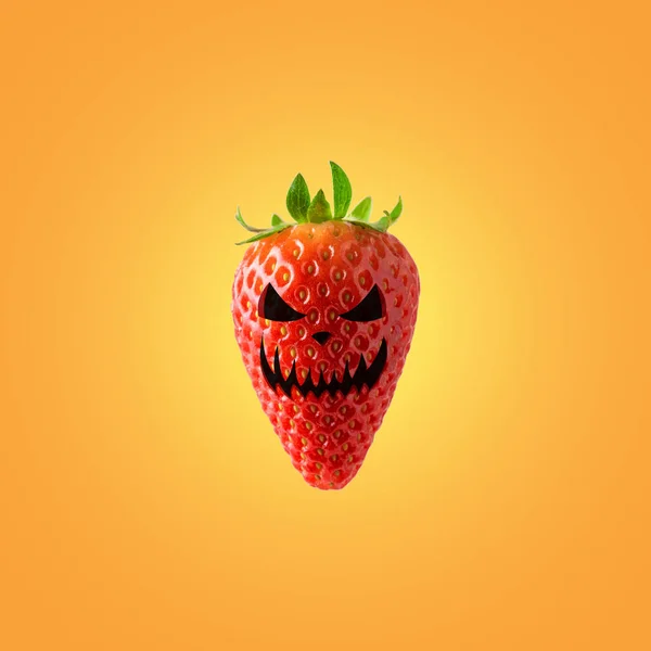 Halloween face on ripe strawberry on bright background. Halloween minimal concept. — Stock Photo, Image