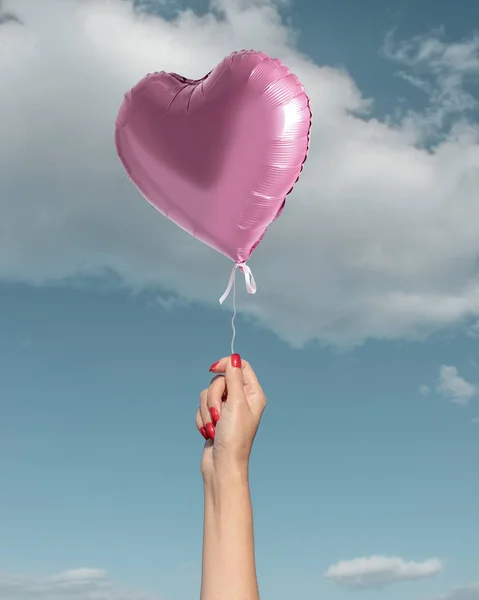 Woman S Hand With Pink Heart Balloon On Background Of Sky Freedom Health Stock Photo