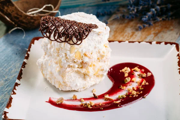 Dessert count ruins airy biscuit with berry sauce — Stock Photo, Image