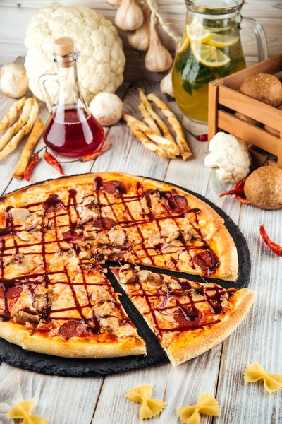 Barbecue pizza pepperoni red onion and mozzarella