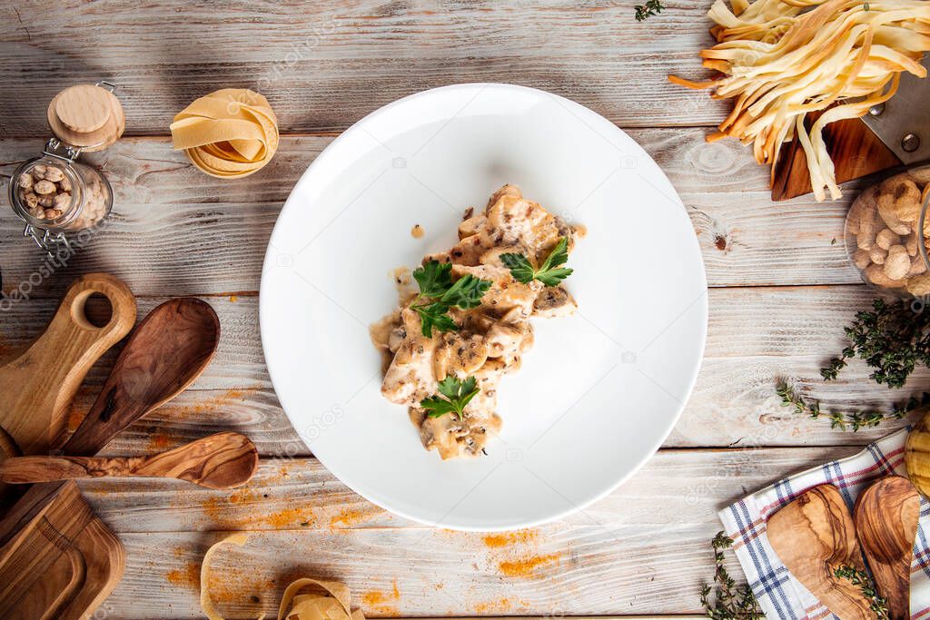 Chicken fillet with mushrooms and creamy sauce