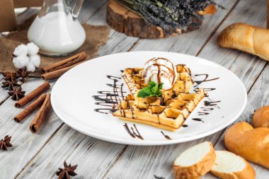 Belgian waffles with ice cream chocolate syrup