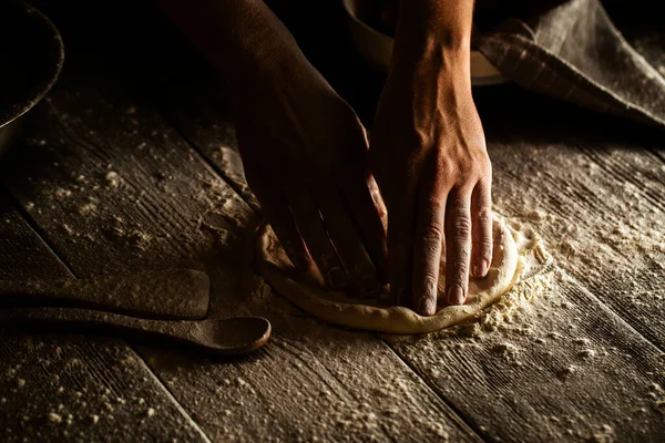 Cooking bakery hands crumple dough into  flat cake — Stock Photo, Image