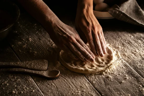 Cooking bakery hands crumple dough into  flat cake — Stock Photo, Image