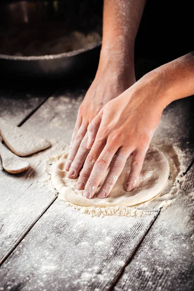 Cooking bakery hands crumple dough into  flat cake — Stock Photo, Image