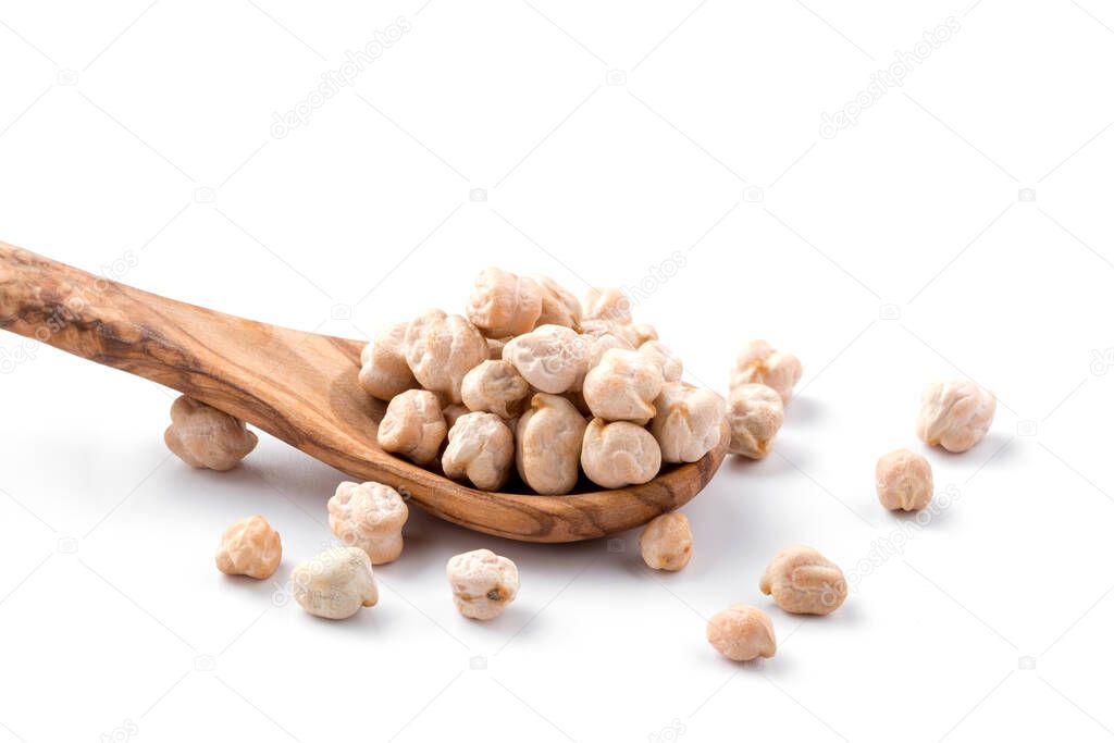 Isolated raw chickpeas in the wooden spoon 