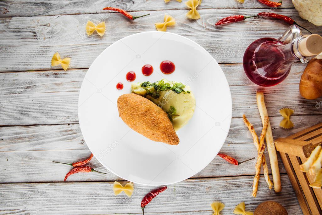 Top view on chicken Kiev cutlet with mashed potato