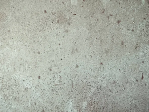 Eski gri benekli beton duvara yakın çekim 