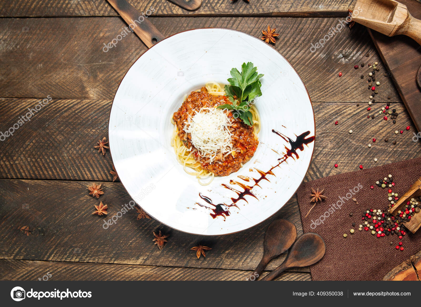 Spaghetti bolognese garnished with parsley Stock Photo by ©Hihitetlin