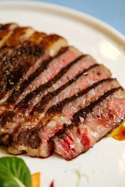 Closeup on grilled and sliced ribeye beef steak — Stock Photo, Image