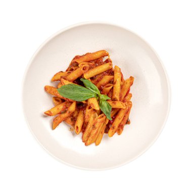 Isolated penne pasta in tomato-based sauce garnished with fresh basil, served on white plate