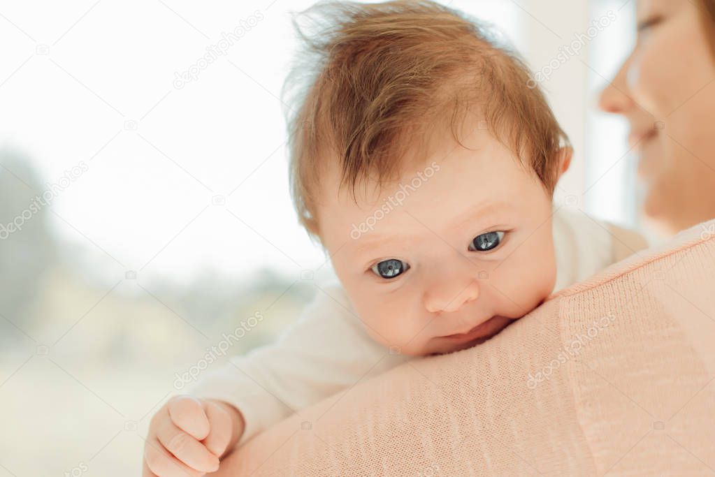 Young Mother holding newborn baby