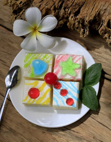 Fancy cake on old wooden floor.