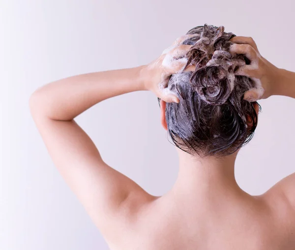Young Woman Back Shot Hands Back Head Hair Has Many — Stock Photo, Image