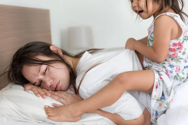 Exhausted tired mother waking up in the morning. — Stock Photo, Image