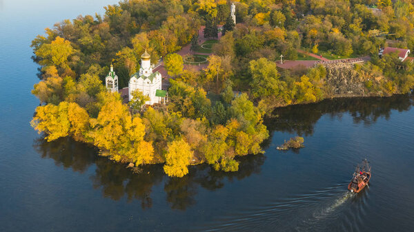 Beautiful autumn panoramic aerial view of Christian Church on Monastic island on Dnieper river in Dnipro city. (Dnepr, Dnepropetrovsk, Dnipropetrovsk)