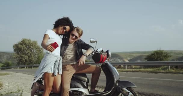 Selfie time beautiful couple , with their 80s motorcycle taking pictures with using a phone. — Stock Video