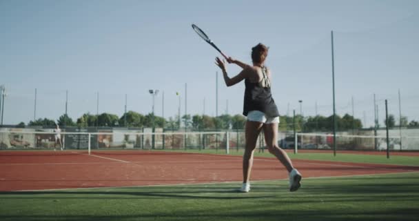 Slow motion two professional tennis players , playing tennis outdoor. 4k — Stock Video
