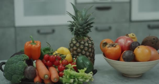 Aesthetic shot of bright colored fruit and vegetables with eggs in a pan. — Stock Video