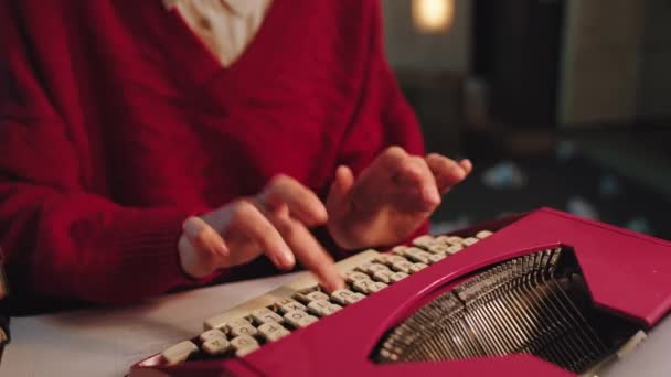 Closeup woman in the office using a retro typewriter machine details. Shot on ARRI Alexa Mini — Stock Video