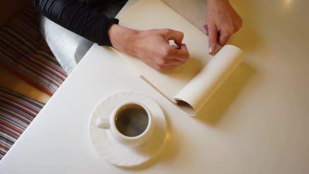 Hand Girl Draws Sketchbook Pencil Cafe Cup Coffee Table Flat — Stock Video