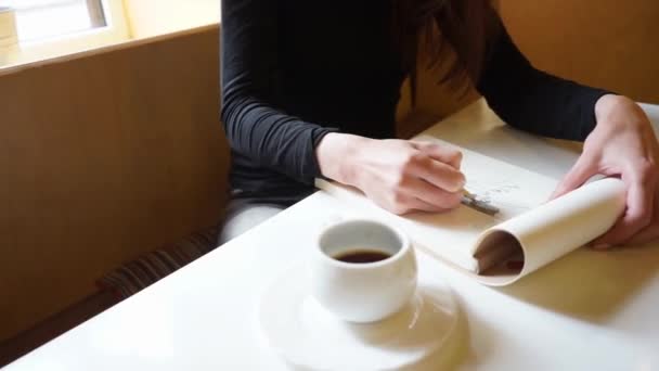 Hand Girl Draws Sketchbook Pencil Cafe Cup Coffee Table Slow — Stock Video