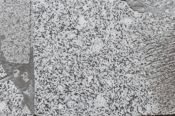 a textured background of granite slabs in concrete. soviet floor design