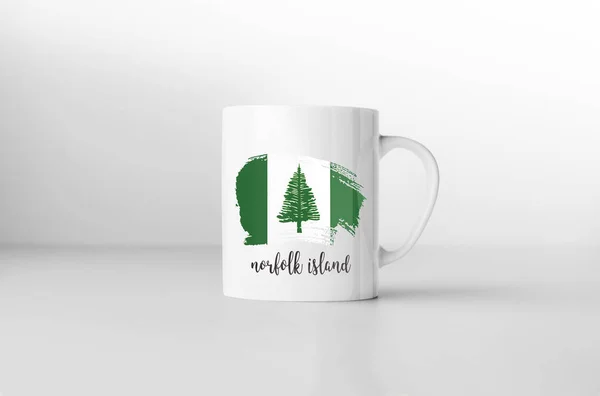 Norfolk Island flag souvenir mug on white background. 3D rendering.