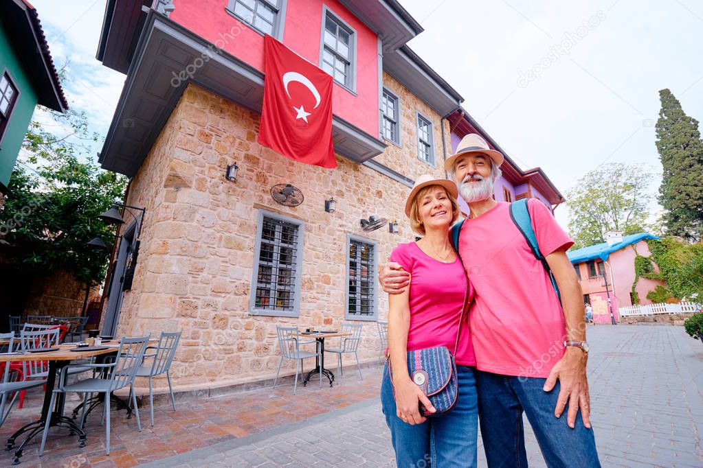  Senior family couple walking together on Turkey's street.