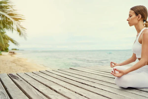 Closeup Young Woman Lotus Pose Wooden Deck Sea View — Stock Photo, Image