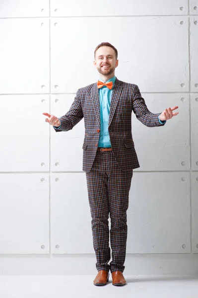 Cheerful Young Man Plaid Suit Bowtie Gesturing Welcome Sign Smiling — Stock Photo, Image