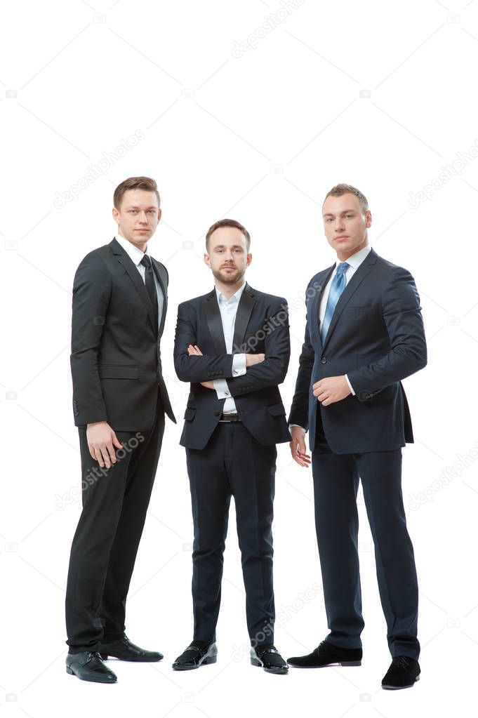 Full length of group of confident businessmen in formal wear standing close to each other