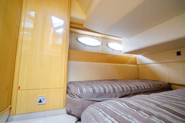 Bedroom interior of modern motor yacht.
