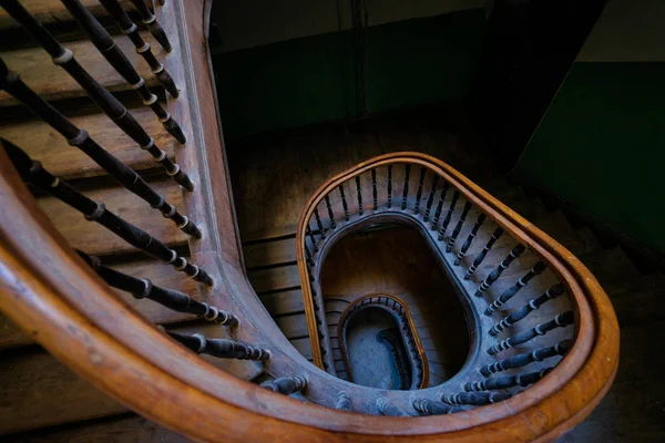 Beautiful old wooden spiral staircase.