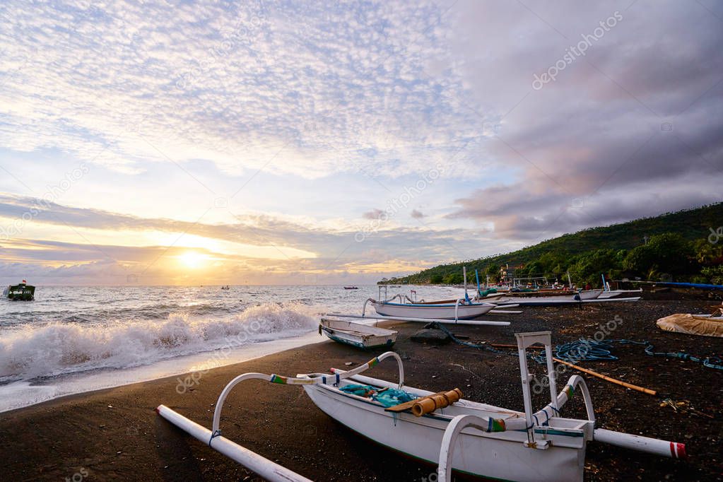 Ocean, beach and indonesian fishing boats.