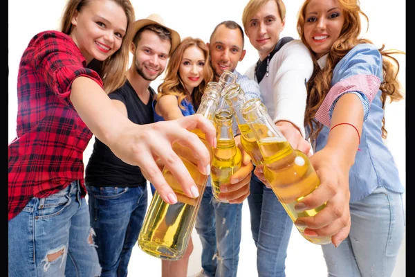 Group of six happy smiling friends with bottles of beer having fun together