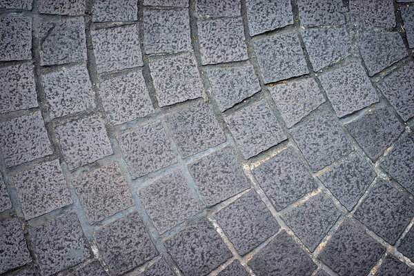 Close-up view of grey tile concrete texture background.