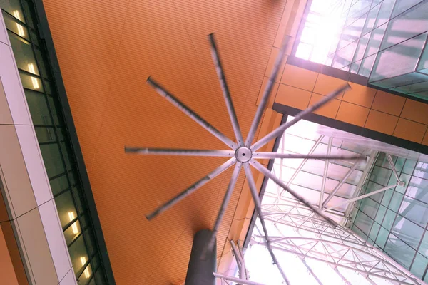 Big ceiling fan in shopping mall or office building.