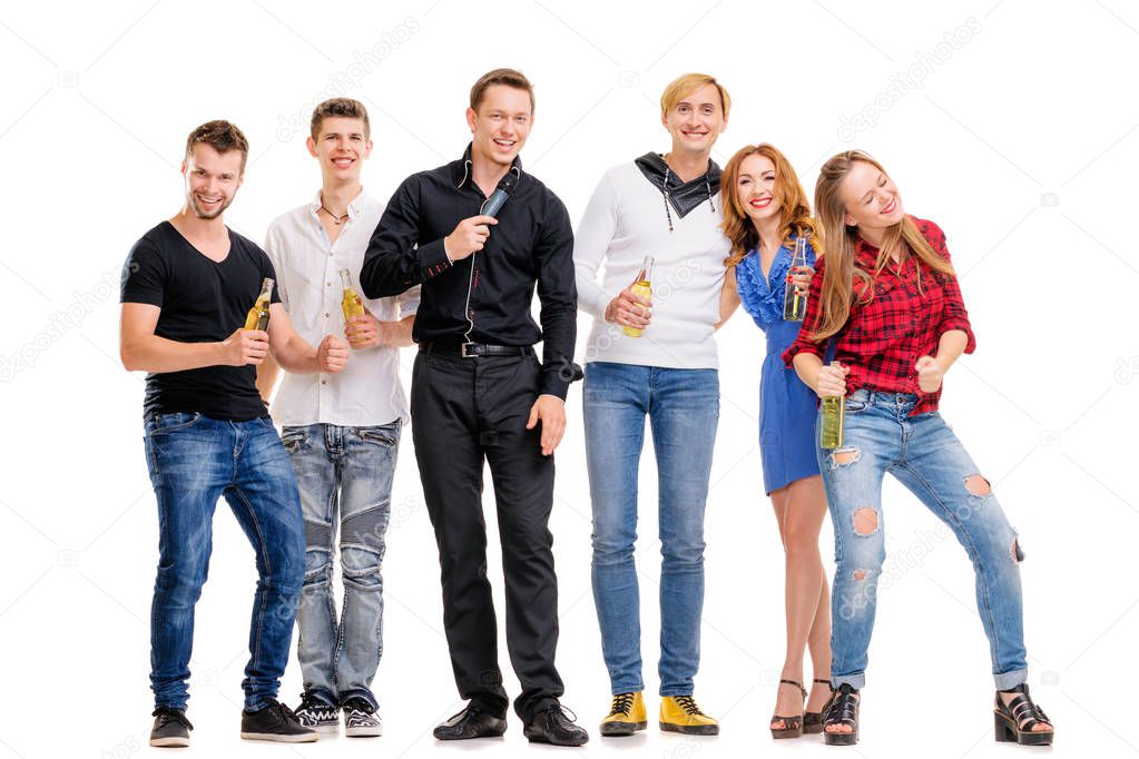 Group of happy smiling friends with bottles of beer having fun together.