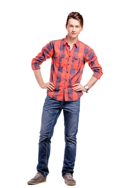 全长工作室肖像英俊的年轻人在格子红色衬衣和牛仔裤 — 图库照片