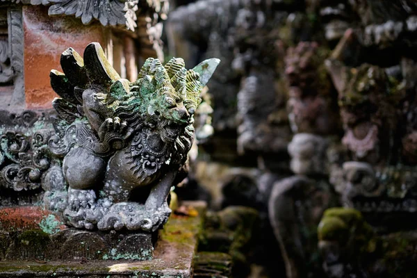Traditional hindu statue of demon at Bali temple.
