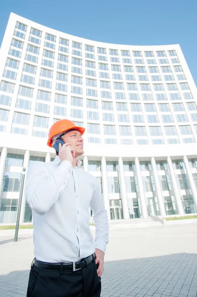 Handsome Young Man Hardhat Talking Mobile Phone While Standing Outdoors — Stock Photo, Image