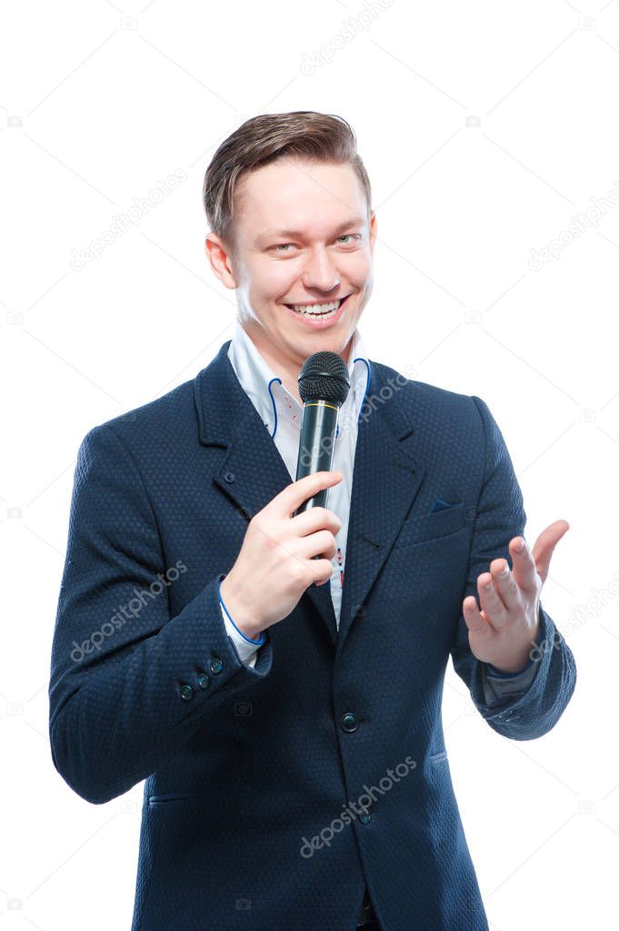 Young elegant talking man holding microphone