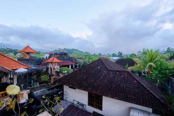 Beautiful backyard view with tiled roofs. Traditional balinese architecture.