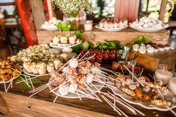 event candy bar stall with various sweet desserts