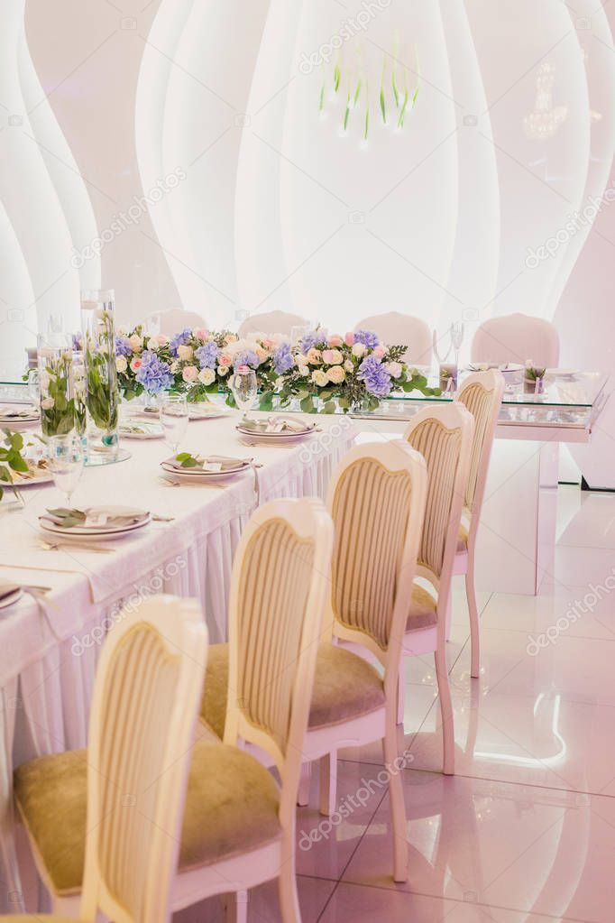 wedding decorated interior with tables and chairs