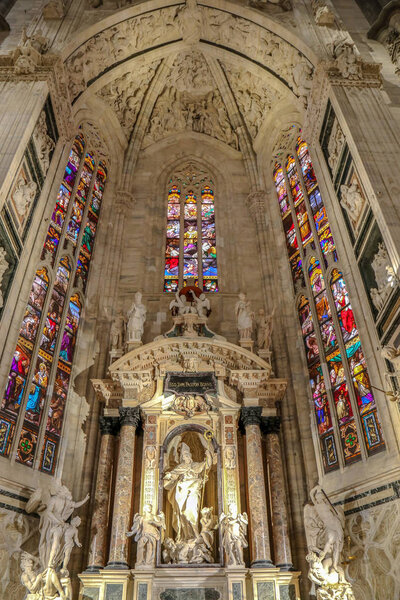 MILAN, ITALY - DECEMBER 11, 2016: Interior at the Milan cathedral. One of the secondary altars, each devoted to a particular saint. 