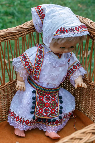 Doll dressed in traditional Romanian folk costume and exposed for sale at one traditional fair.