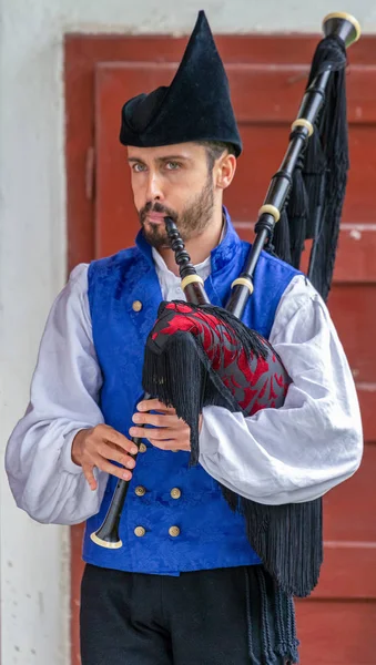 Young man from Spain, folk interpreter at bagpipe — Stock Photo, Image