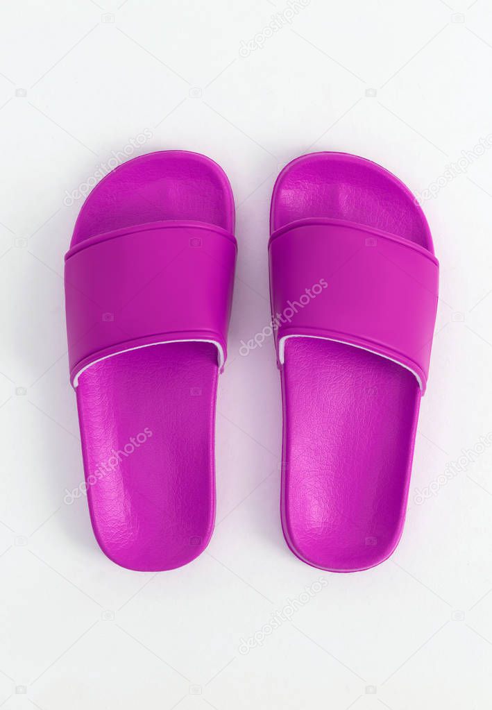 Bright purple stylish rubber slippers, on a white and gray background, mock-up